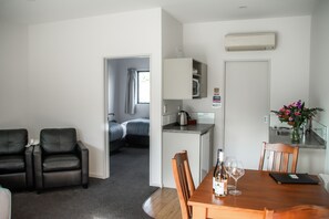 Family Unit - Queen & 2 singles | Living area | 43-inch flat-screen TV with satellite channels - Carrick Lodge Motel (Cromwell)