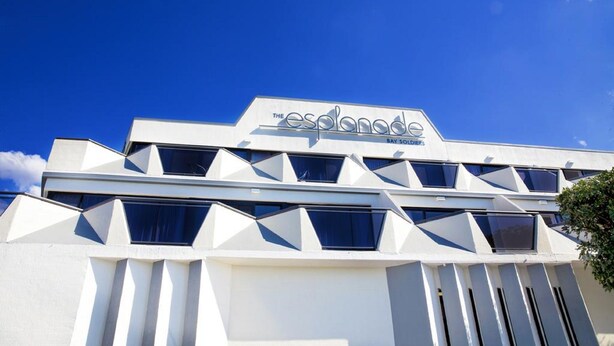 A modern building with a geometric facade and a sign that reads "The Esplanade Bayfront." - The Esplanade (Batemans Bay)