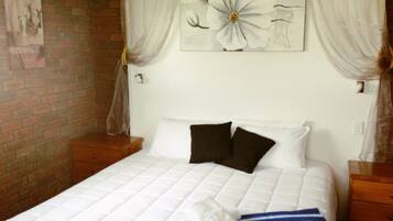 Premium bedding, pillow-top beds, blackout curtains, iron/ironing board