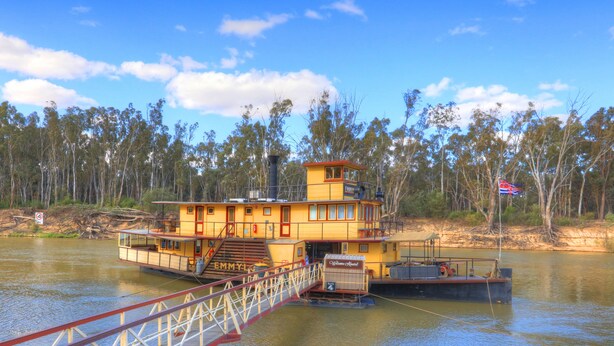 A yellow boat with a red roof, a staircase leading to the upper deck, and a sign that reads "Welcome aboard." - Moama Central Motel (Moama)