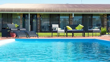 Outdoor pool, pool umbrellas, sun loungers