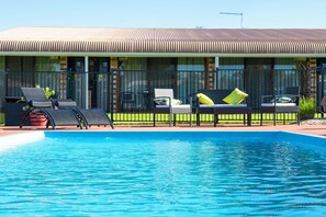 Outdoor pool, pool umbrellas, pool loungers