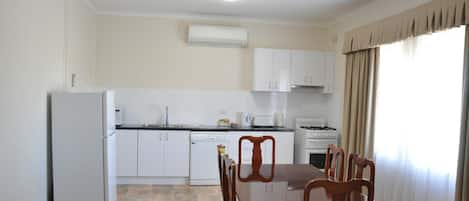 Family Suite, 3 Bedrooms, Kitchen | Private kitchen | Fridge, coffee/tea maker, electric kettle