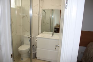 Shower, free toiletries, hair dryer, towels