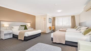 Superior Family Room | Premium bedding, desk, laptop workspace, blackout curtains