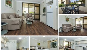 Un apartamento moderno con sala de estar, comedor, cocina y balcón.