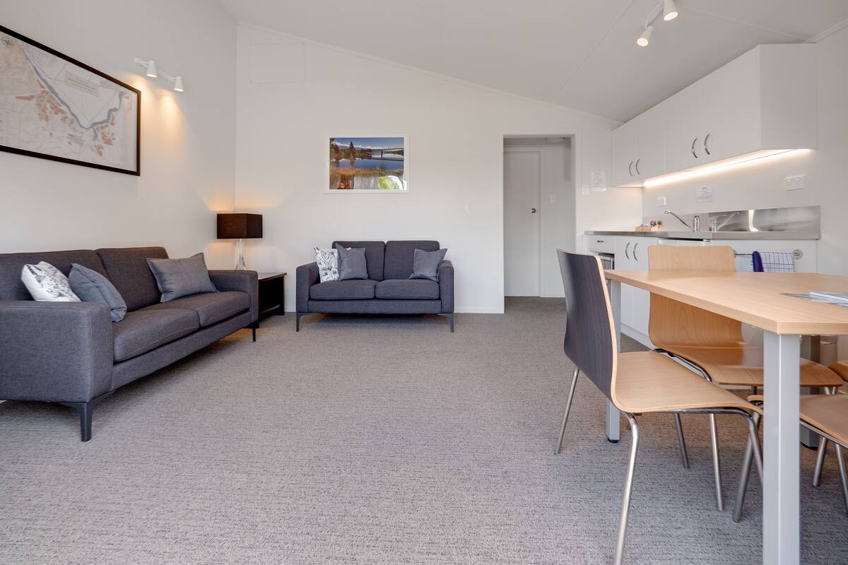 Standard Apartment Two Bedrooms with Kitchenette | Living area | 32-inch flat-screen TV with satellite channels, TV
