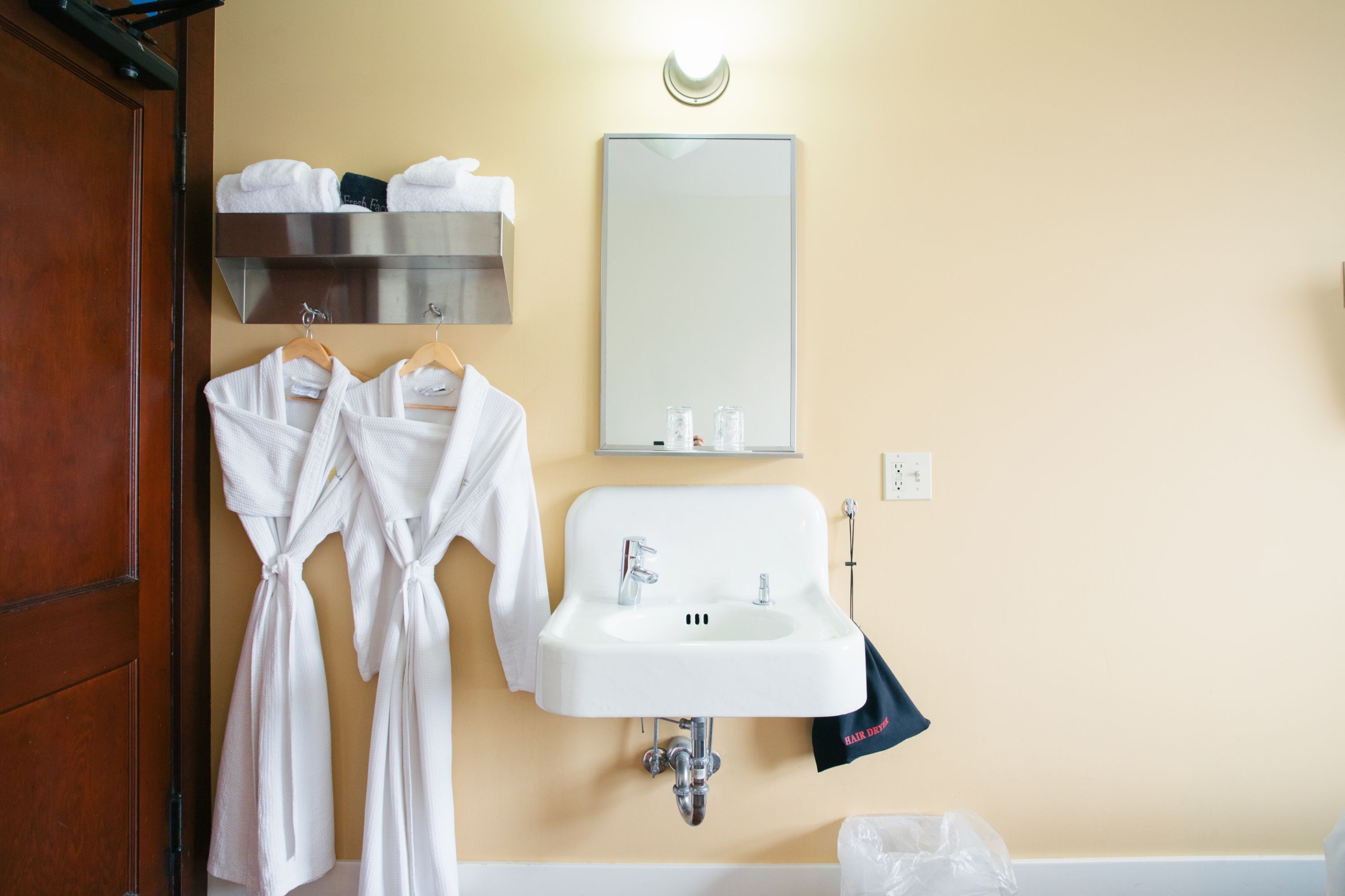 small room, shared bathroom | bathroom | hair dryer, towels