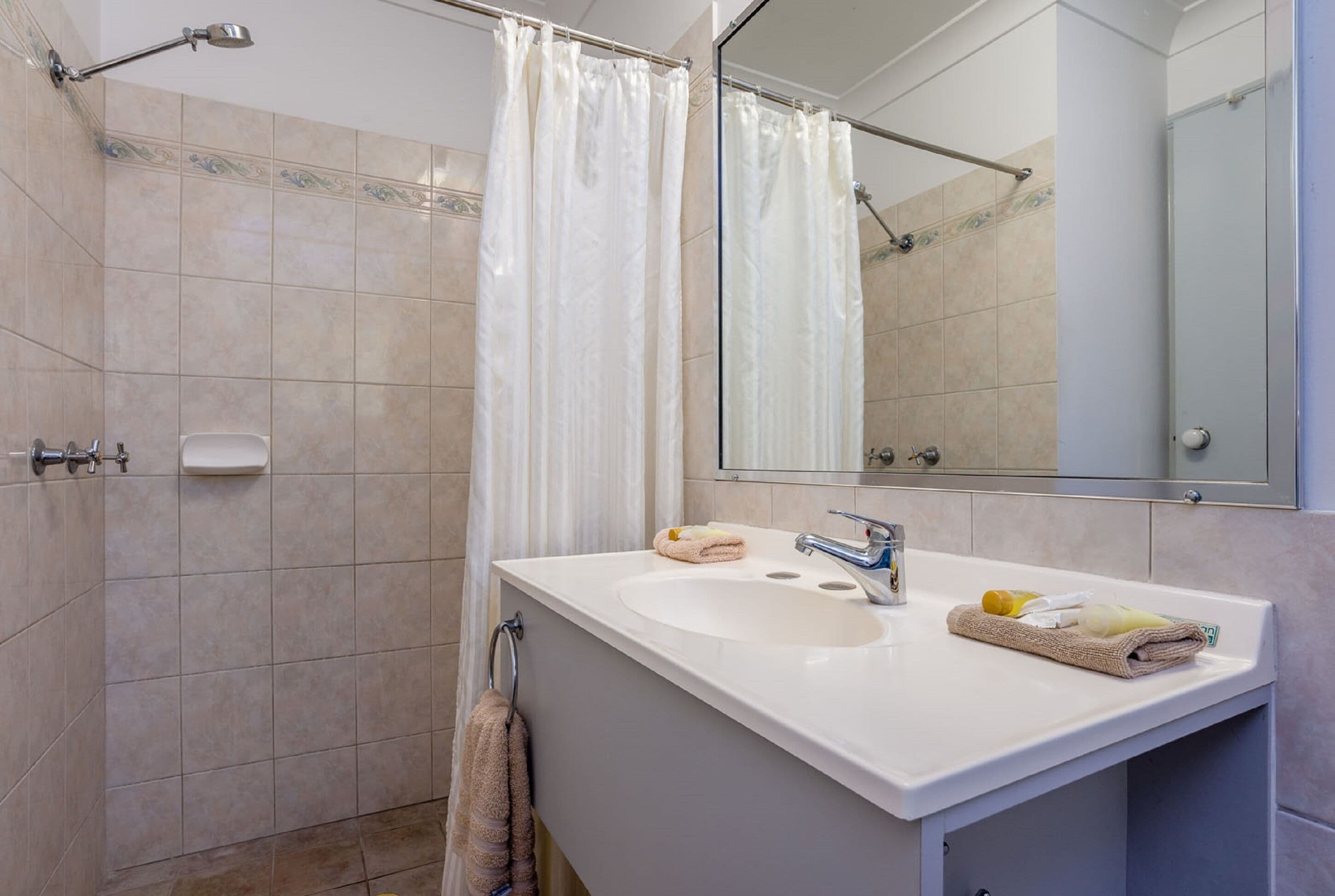 family room with kitchen | bathroom | free toiletries, hair dryer, towels