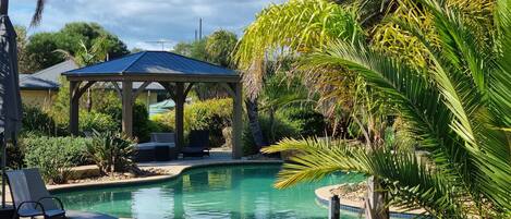 2 outdoor pools, open 9:00 AM to 9:00 PM, pool umbrellas, pool loungers
