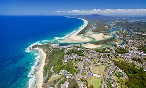 An aerial view of a coastal town with a beach, roads, and residential areas. - BIG4 Tasman Holiday Parks - Nambucca Heads (Nambucca Heads)