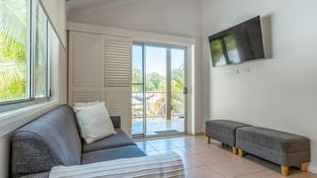 Elevated Surf Shack | Living area | 27-inch flat-screen TV with digital channels, TV, ping pong