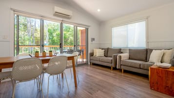 Premium Villa | Living area | 27-inch flat-screen TV with digital channels, TV, ping pong