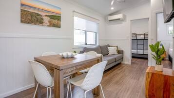 Luxury Cabin | Living area | 27-inch flat-screen TV with digital channels, TV, table tennis