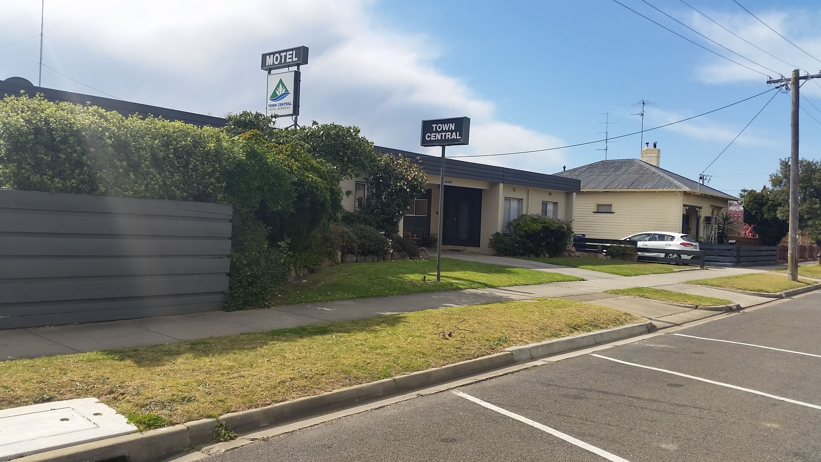 A motel with a sign indicating 'Town Central Motel Barndale'.