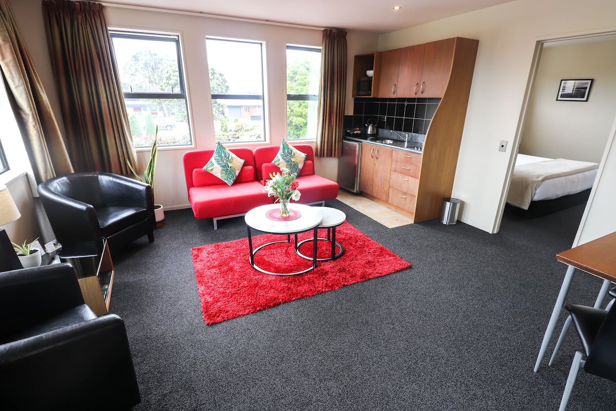 Executive One Bedroom Apartment | Living area | 50-inch Smart TV with digital channels, Netflix, streaming services