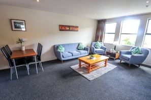 Two Bedroom Apartment | Living area | 50-inch Smart TV with digital channels, Netflix, streaming services - Coleraine Suites & Apartments (Greymouth)