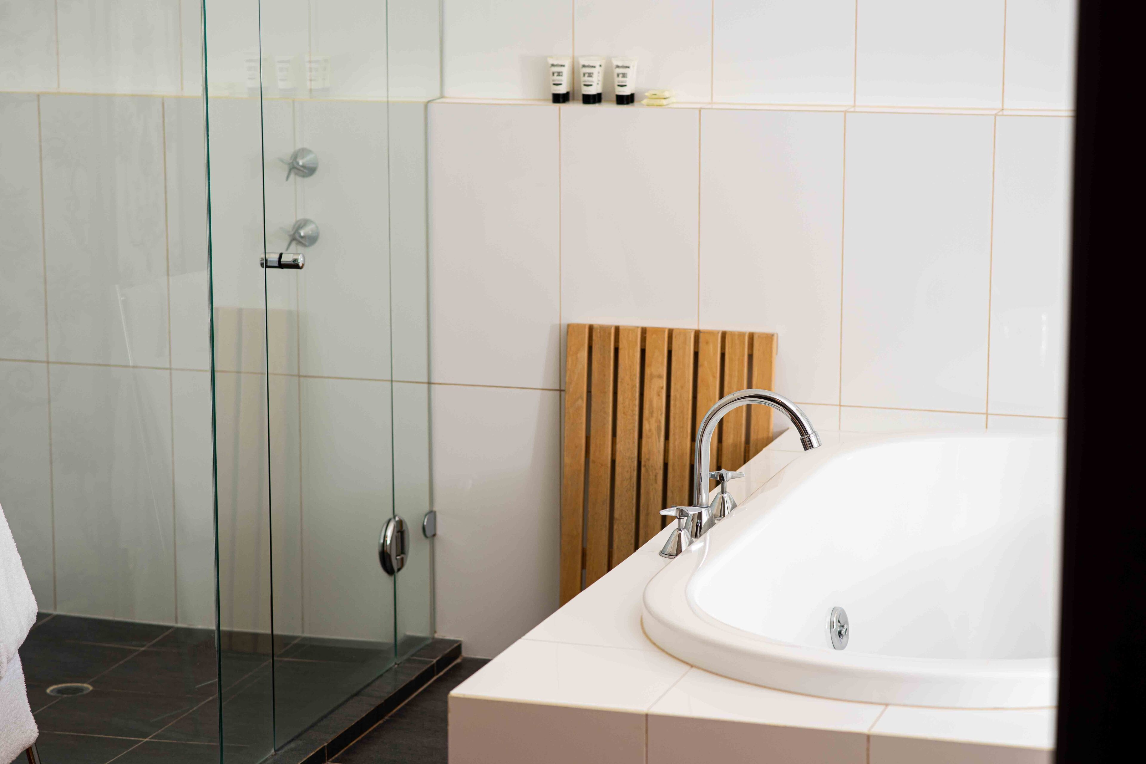 matthews suite | bathroom | shower, free toiletries, hair dryer, towels