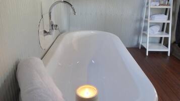 Separate bathtub and shower, hair dryer, bathrobes, towels