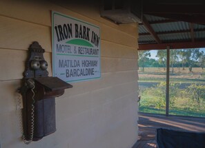 A sign for Iron Bark Inn, a motel and restaurant, located on Matilda Highway in Barcaldine.