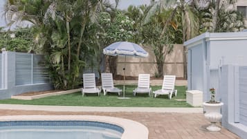 Outdoor pool, open 7:00 AM to 8:00 PM, pool umbrellas, pool loungers