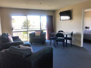 Executive Apartment, 2 Bedrooms, Balcony (Spa Apartment 8) | Living area | 40-inch LCD TV with cable channels, TV