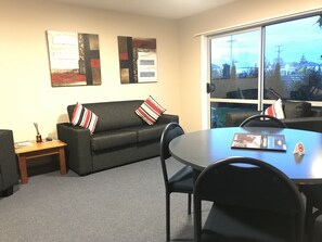 Executive Apartment, 2 Bedrooms, Garden Area | Living area | 40-inch LCD TV with cable channels, TV