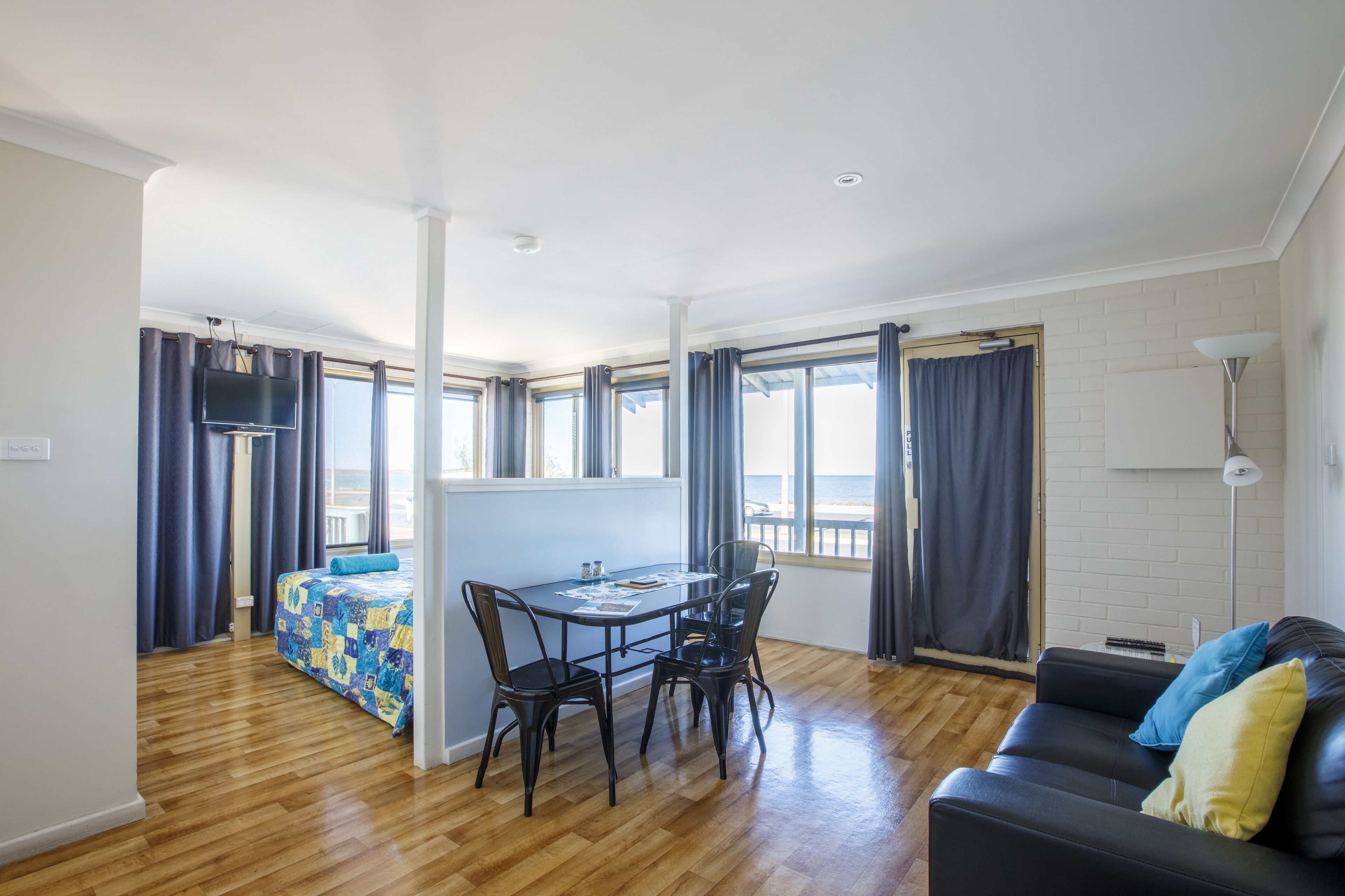 Oceanview Studio Unit (1Q) | Living area | Flat-screen TV