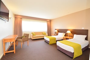 Standard Suite | Living area | 42-inch plasma TV with digital channels, TV