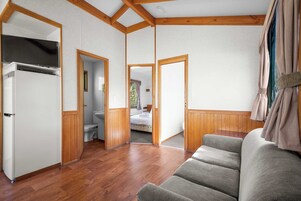 Standard 2 Bedroom Cabin - Sleeps 4 - Not Pet Friendly | Living area | TV, DVD player