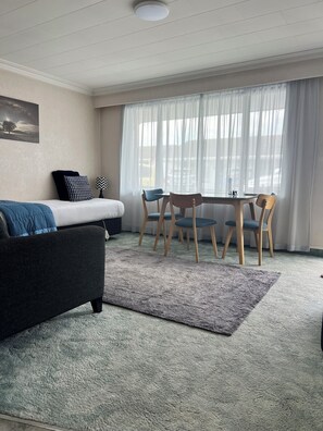 One Bedroom Unit  | Living area | 49-inch TV with digital channels - ASURE Surrey Court (Invercargill)
