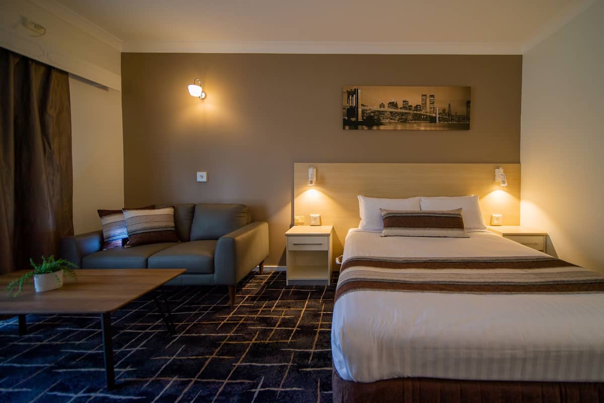 Deluxe Room, 1 Queen Bed, Kitchenette | In-room safe, individually decorated, individually furnished