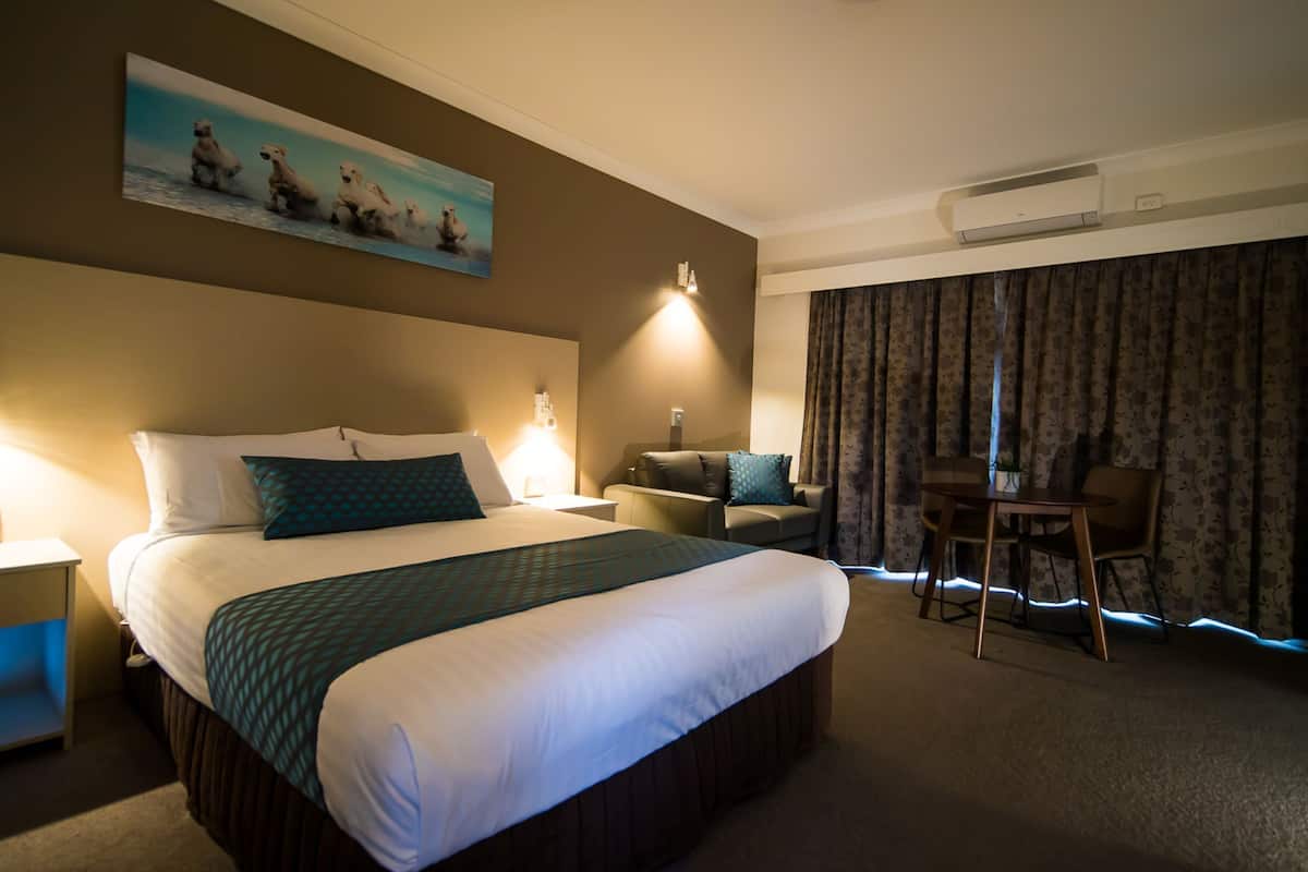 Family Room (1 Queen and 2 Single Beds) | In-room safe, individually decorated, individually furnished