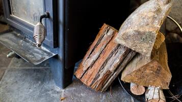 A rustic wooden door with a metal handle and a metal latch.