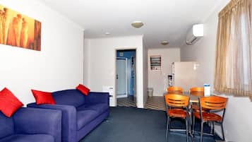 Two Bedroom Suite | Living area | 32-inch LCD TV with satellite channels, TV