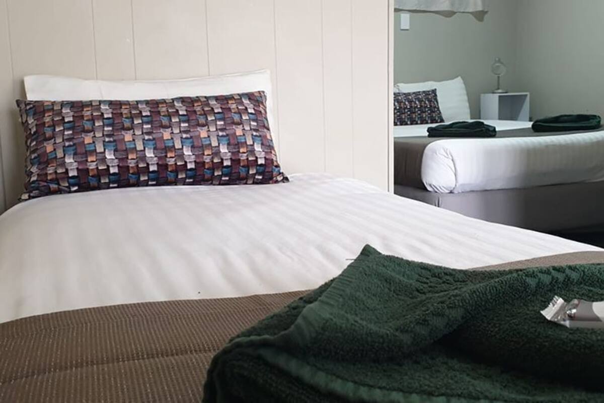 Desk, blackout curtains, iron/ironing board, rollaway beds