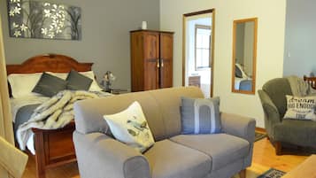Cottage Deluks, 1 Tempat Tidur Queen | Area keluarga | TV layar datar, perapian, dan pemutar DVD