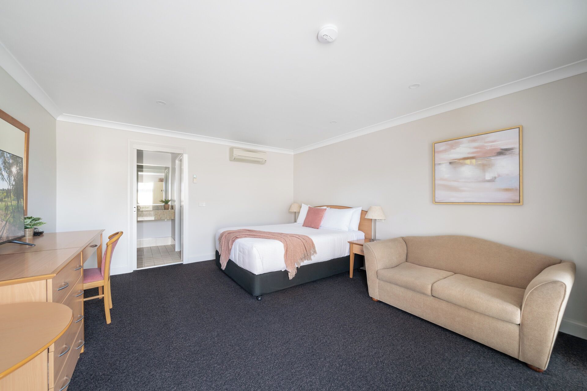 Premium bedding, desk, laptop workspace, iron/ironing board