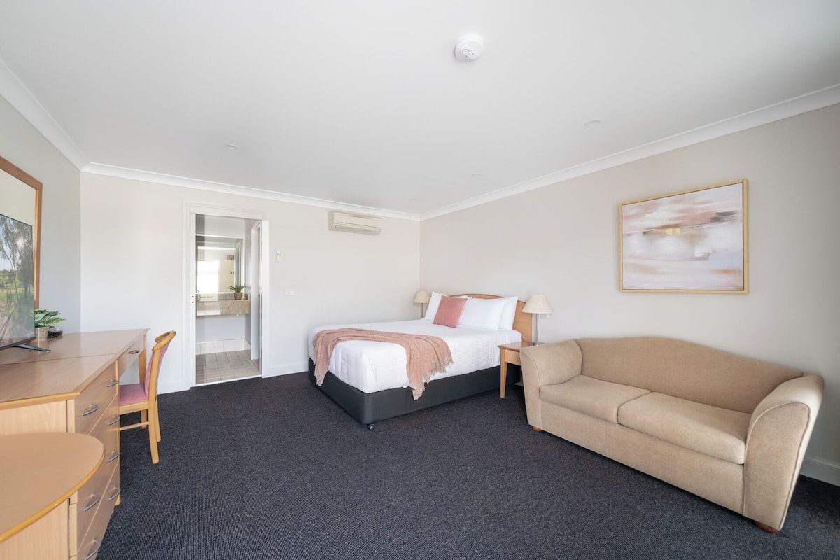 Premium bedding, desk, laptop workspace, iron/ironing board