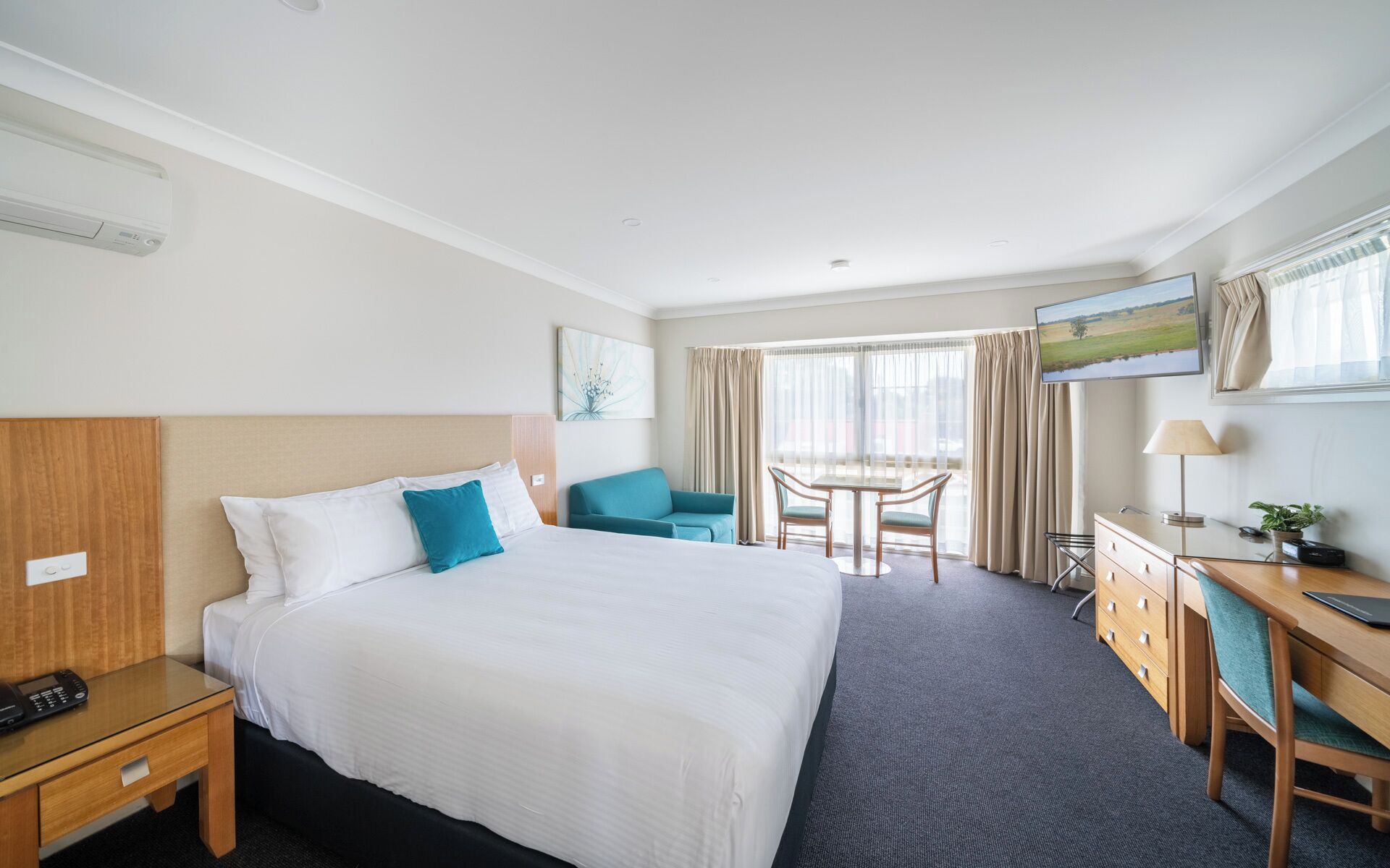Premium bedding, desk, laptop workspace, iron/ironing board