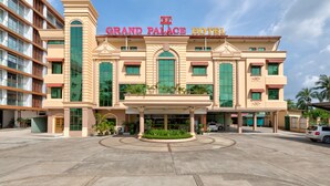 A hotel with a grand entrance, multiple floors, and a prominent sign. - Grand Palace Hotel (Yangon)