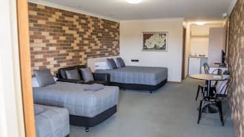 Desk, laptop workspace, blackout curtains, iron/ironing board