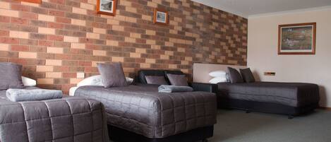 Desk, laptop workspace, blackout drapes, iron/ironing board