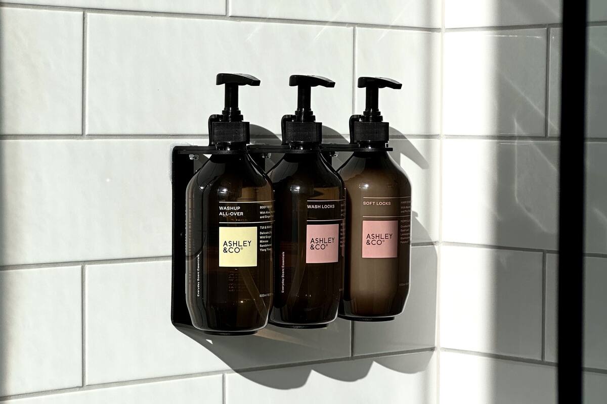 shower, designer toiletries, hair dryer, towels