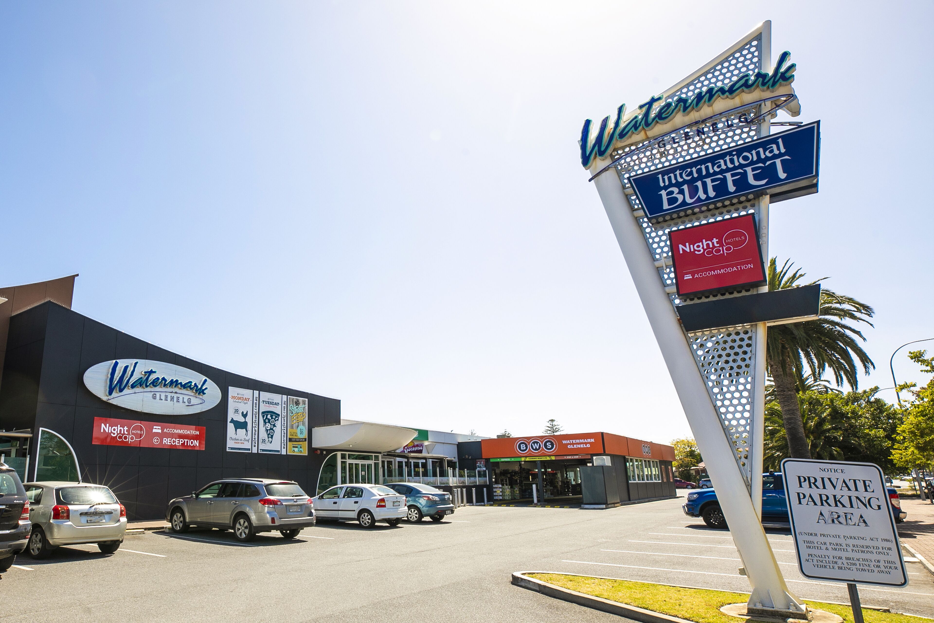 A Watermark Inn & Suites with an International Buffet, a Nightcap Hotel, and a Private Parking Area.