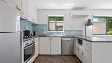 Two Bedroom Premium Family Villa | Private kitchen | Full-sized fridge, microwave, oven, stovetop