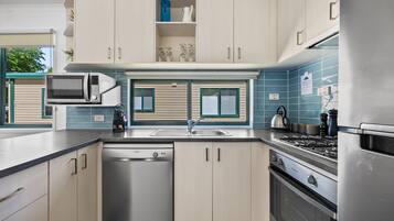 Two Bedroom Premium Villa | Private kitchen | Full-sized fridge, microwave, oven, stovetop