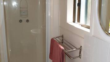 Shower, hair dryer, towels, toilet paper