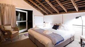 A bedroom with a bed, a chair, a desk, and a window. - Ratho Farm (Bothwell)