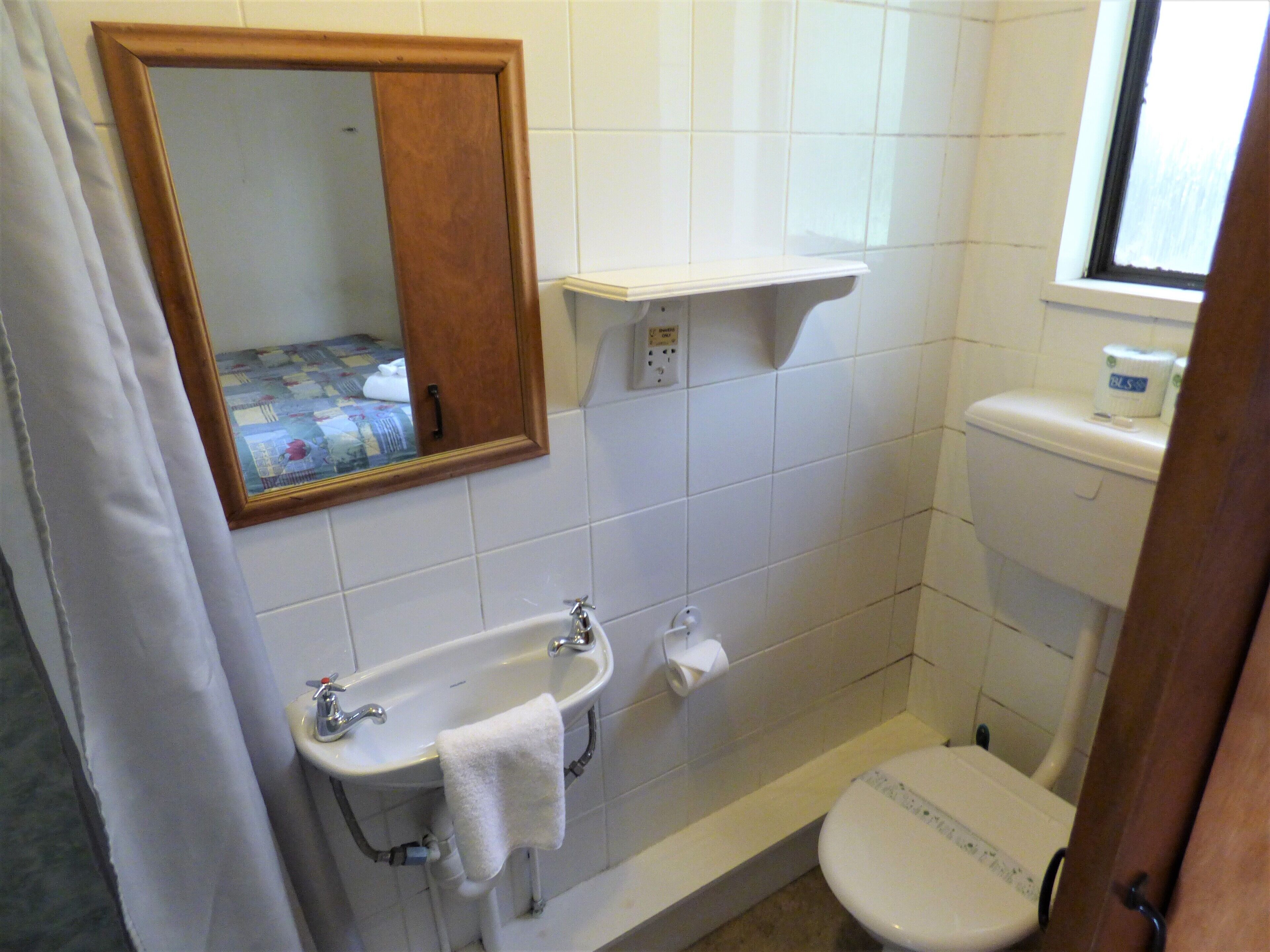 basic one-bedroom apartment with private bathroom | bathroom | shower, towels